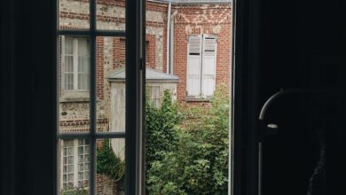 open window across red building